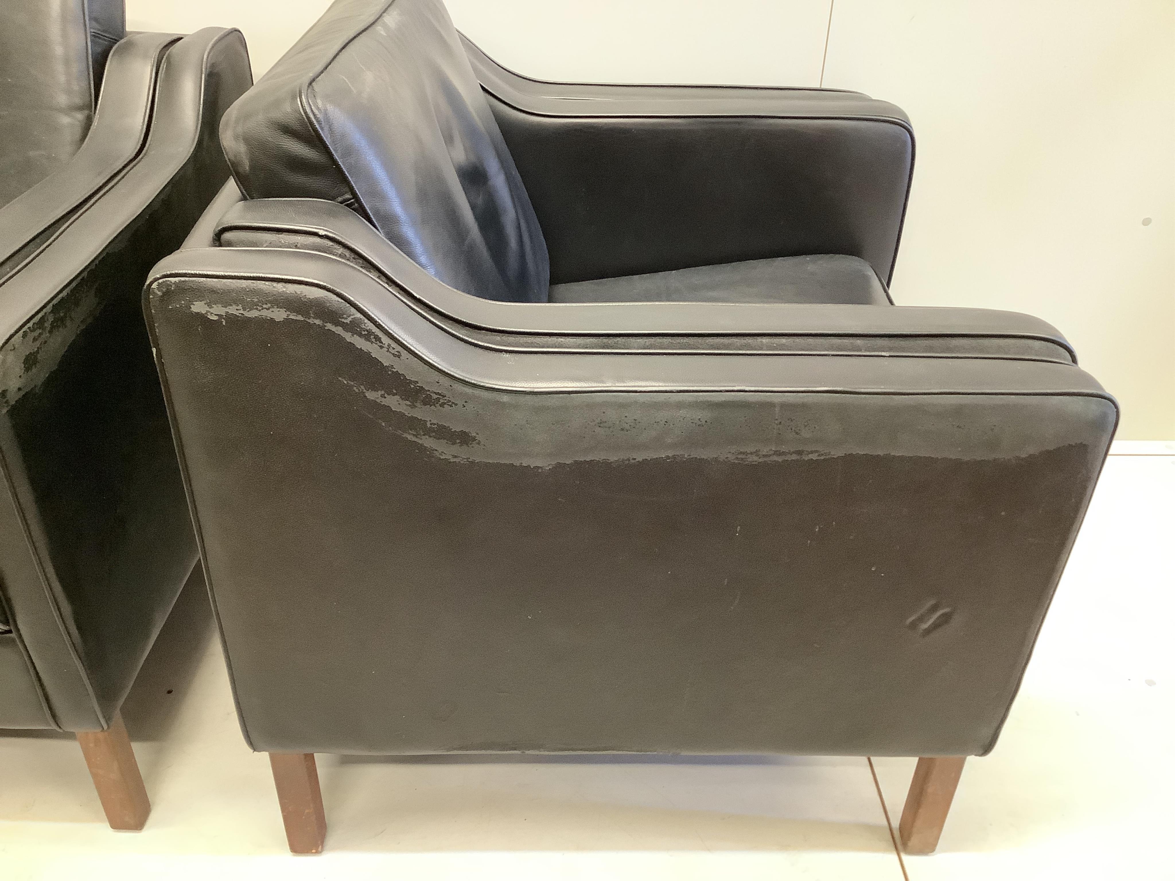 In the manner of Morgensen, a pair of black leatherette armchairs, width 92cm, depth 80cm, height 82cm. Condition - fair
